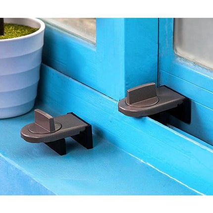 Sliding Sash Stopper Baby Safety Lock For Windows And Doors installed on blue window sill showing compact iron stopper preventing sash opening