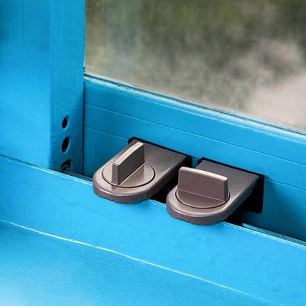 Sliding Sash Stopper Baby Safety Lock For Windows And Doors installed on blue window frame, thick iron compact slider limiting sash opening for child safety