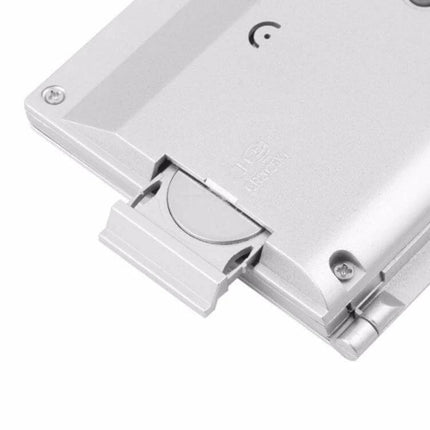 Portable Folding LCD Travel Alarm Clock With Temperature Display showing silver fold-out battery compartment and hinge detail