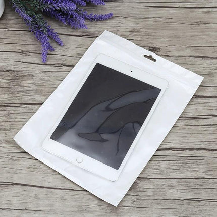 Clear Front White Pearl Zip Lock Bag for Jewelry Storage, 30cm x 40cm showing tablet inside clear-front pouch on wooden background