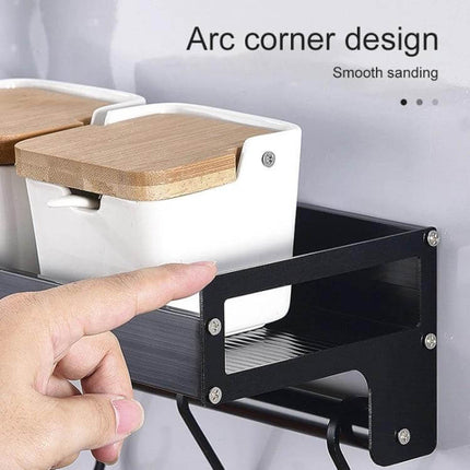 50cm Wall Mount Kitchen Seasoning Rack for Spices and Bottles mounted on wall holding spice jars with bamboo lids, black aluminum rust‑resistant finish