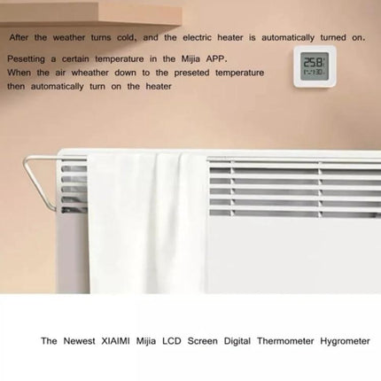 Xiaomi Mijia Bluetooth Temperature and Humidity Thermometer for Home Use mounted on wall above radiator showing 25.8°C display