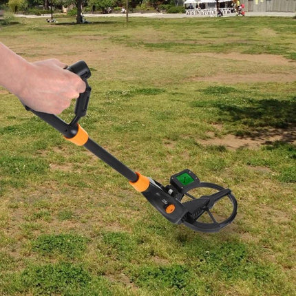 Easy-to-Use Underground Metal Detector Toy for Kids with LCD Screen showing child scanning grassy park for coins and jewelry