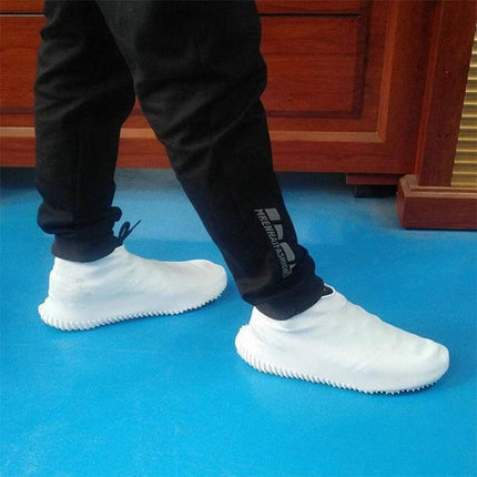 Waterproof Silicone Rainboot Covers for Everyday Outdoor Protection, Size L - white silicone boot covers on person walking