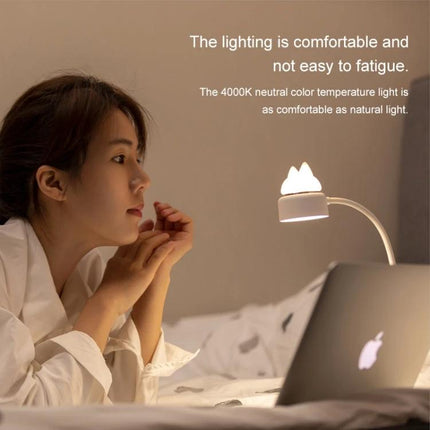 Cat-Shaped LED Lamp for Daily Desk and Night Use showing woman relaxing with lamp beside laptop, warm 4000K light reducing eye strain