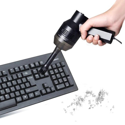 Handheld Portable USB Suction Cleaner for Keyboards and Laptops removing crumbs and dust from a computer keyboard with strong suction