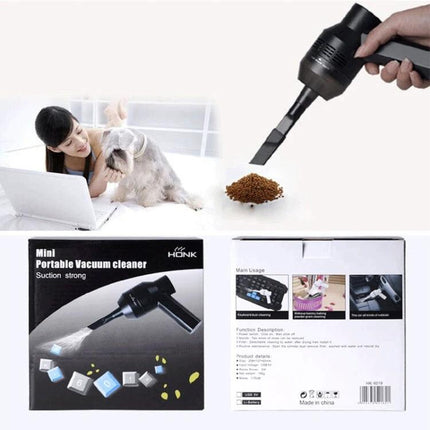 Handheld Portable USB Suction Cleaner for Keyboards and Laptops - compact vacuum removing crumbs and pet hair from laptop and keyboard