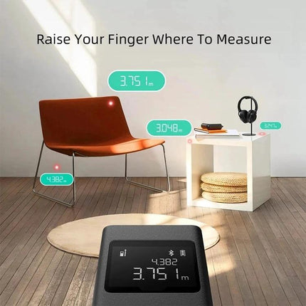 Xiaomi Smart Laser Distance Measurer for Home Projects measuring chair and side table distances in living room scene