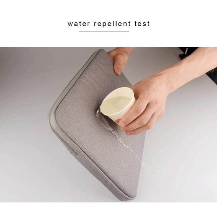 Soft Oxford Cloth Protective Bag for 14-Inch Laptops and Tablets water-repellent grey sleeve shown with water pouring off to demonstrate protection
