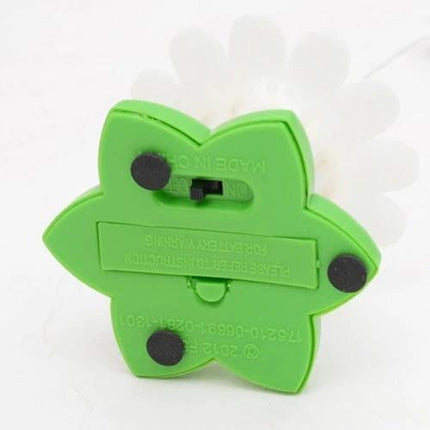 Cat Toy with Fluttering Butterfly for Indoor Playtime - green flower base underside showing battery compartment and on/off switch