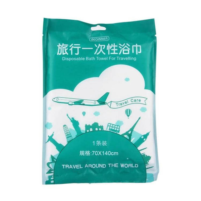Portable Disposable Travel Cotton Bath Towel 140x65cm in teal travel packaging showing airplane and landmarks
