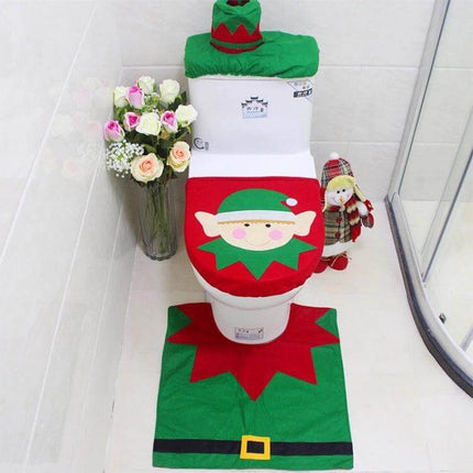 Santa Elf Christmas Bathroom Set With Toilet Seat Cover And Rug showing festive elf toilet seat cover, tank cover, and matching rug in red and green
