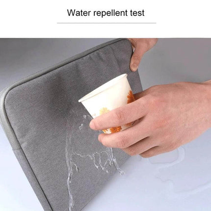 Protective Sleeve for Laptops Up to 15.6 Inches and Tablets water-repellent grey sleeve being tested with spilled water, soft-lined protective case