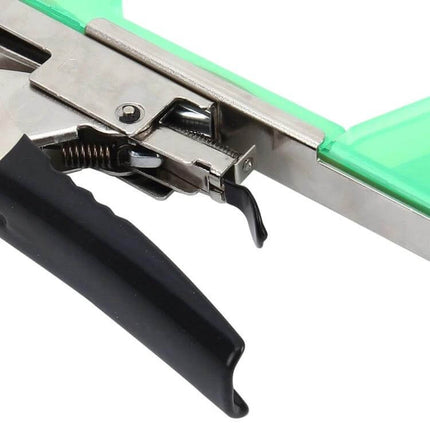 Agriculture Tape Tool Hand Tying Machine For Garden Plants Green — close-up of green handheld one-handed plant tying tool showing metal mechanism and black handle