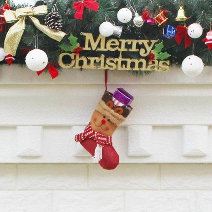 Hang Ornament Christmas Stockings Gift Bags For Decorating - red reindeer stocking hanging on mantel with gifts and festive wreath