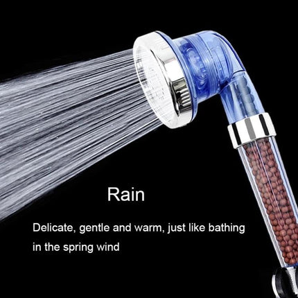 Adjustable Shower Head for Everyday Home Bathroom Use showing rain mode, clear blue handheld head with water stream and mineral beads