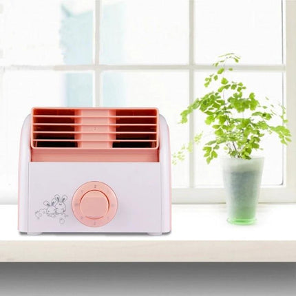 Bladeless Mini Desktop Fan for Quiet Everyday Cooling in Homes on a desk near a window with a plant, compact pink-and-white design