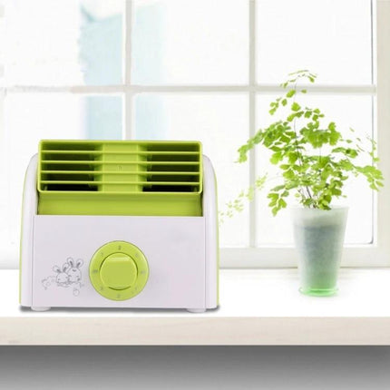 Bladeless Mini Desktop Fan for Quiet Everyday Cooling in Homes on a white desk near a window with a green potted plant