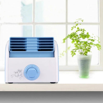 Bladeless Mini Desktop Fan for Quiet Everyday Cooling in Homes on a desk by a window providing quiet adjustable airflow