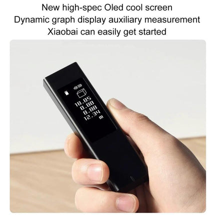 Xiaomi Youpin DUKA LS5 Touch Screen Laser Distance Measurer handheld showing OLED touch display with measurement readings