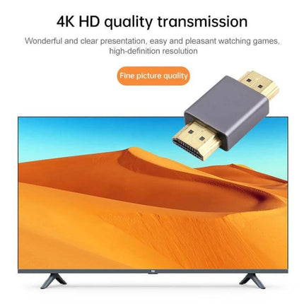 Gold-Plated HDMI Male to Male Adapter for Home Theater Connections - gold-plated HDMI adapter shown above HDTV for clear 1080P video