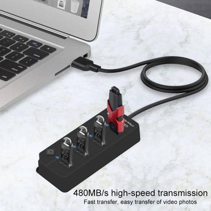 Onten USB Splitter for Charging and Data Transfer with Independent Switches plugged into laptop, four-device USB hub with independent switches