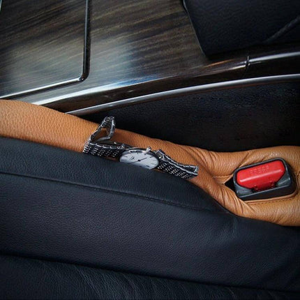 Alt Tag: Leather Car Seat Gap Filler for Preventing Items from Falling placed between seats securing keys and watch near seat belt catch