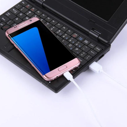 Charging Cables for Everyday Smartphone Charging Needs - set of five white cables charging a pink smartphone connected to a laptop
