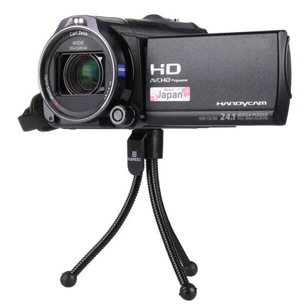 HAWEEL Flexible Octopus Tripod for Phones and Cameras mounted with a handheld camcorder on a flexible mini tripod for stable shooting