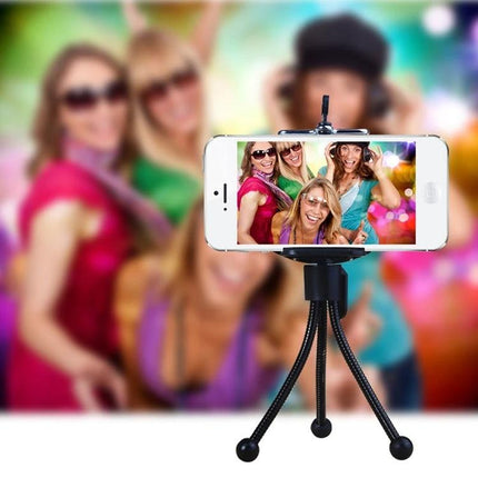 HAWEEL Flexible Octopus Tripod for Phones and Cameras holding a phone for a group selfie on uneven surfaces