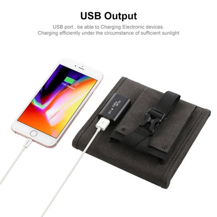 HAWEEL Portable Foldable Solar Charger for Travel and Outdoors charging a smartphone via USB on a folded solar panel with buckle