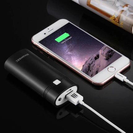 Build Your Own HAWEEL Power Bank for Daily Phone Use - assembled HAWEEL power bank charging smartphone on black surface
