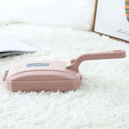 Handheld Carpet Brush Two-Row Design For Pet Hair And Debris on white carpet, pink PP body with ergonomic handle and two-row nylon bristles