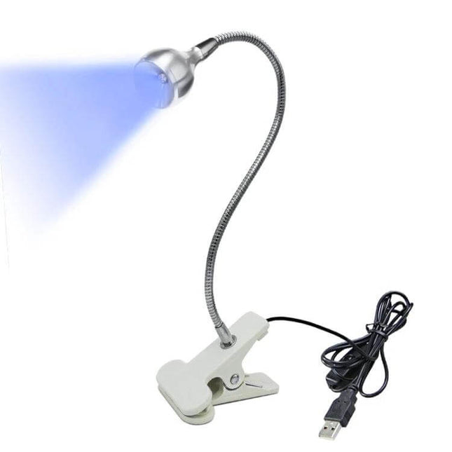 Handheld USB Clip On UV Disinfection Lamp For Everyday Surfaces shown in pocket-sized clip-on lamp with flexible neck and USB cable