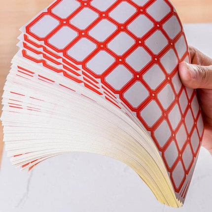 Handwritten Self Adhesive Label Stickers for Price Marking — stack of large white labels with red border held fanned for neat handwritten price marking