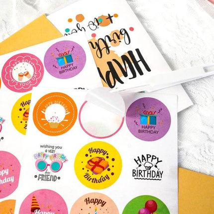 Happy Birthday Greeting Cards 24-Card Set with Envelopes featuring colorful birthday sticker sheet and folded cards in gift-box packaging