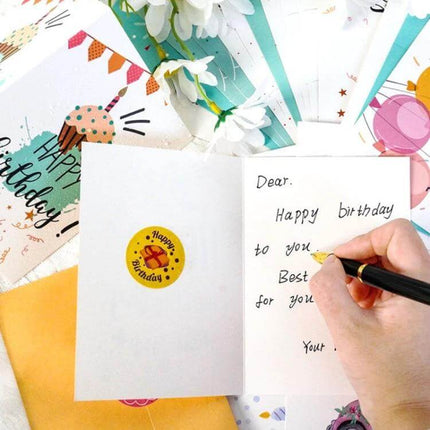 Happy Birthday Greeting Cards 24-Card Set with Envelopes showing open folded card, sticker, envelopes and hand writing a birthday message