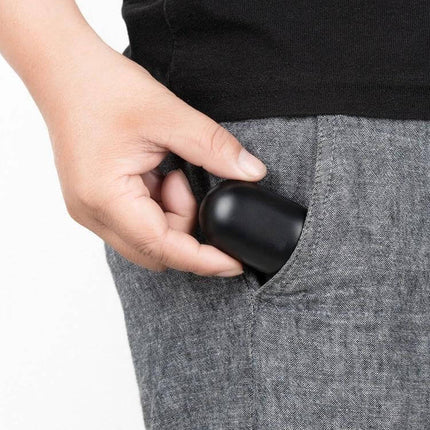 Hearing Aid Sound Amplifier Mini USB Charging For Everyday Use — compact black device tucked into pants pocket for discreet daily amplification