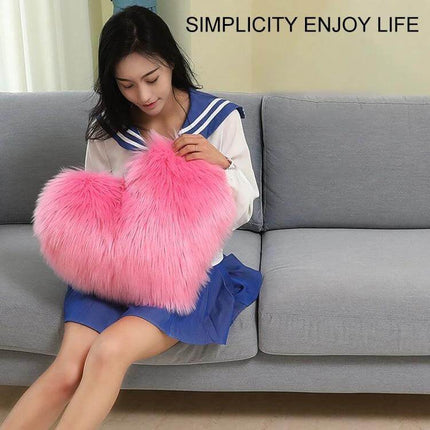Home Cushion Pillow 40x50 Cm For Sofa And Bed Use - pink heart-shaped plush cushion on sofa held by woman
