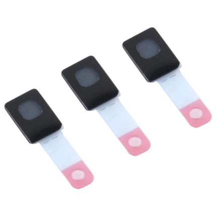 Replacement Sticker for iPhone 12 Microphone in Daily Use — three small black replacement stickers with pink pull tabs for iPhone 12 microphone repair