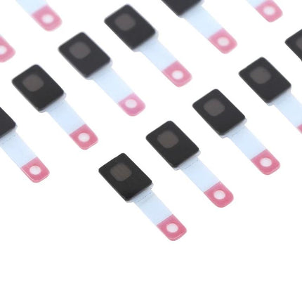 Replacement Sticker for iPhone 12 Microphone in Daily Use - close-up of multiple small adhesive mic replacement stickers for iPhone 12