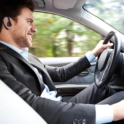 V9 Bluetooth Handsfree Headset For Driving And Commuting Use shown worn by a driver making handsfree calls while driving safely