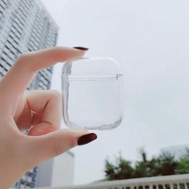 Transparent Protective Case for Apple AirPods in Daily Use - clear PC shell held between fingers showing slim, odor-free protection for AirPods 1 and 2