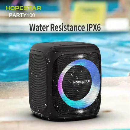 HOPESTAR Compact Portable Bluetooth Speaker For Outdoor Travel shown by waterproof IPX6 cube speaker by a poolside with RGB ring lights