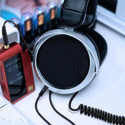 Replacement Audio Cable for Denon Headphones and Similar Models connected to silver open-back headphones with coiled cable and portable DAC for audiophiles