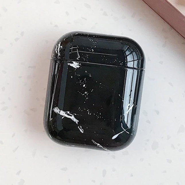 Marble Design Protective Case for Daily AirPods Carry in glossy black with white marble streaks, slim dust-and-scratch protection