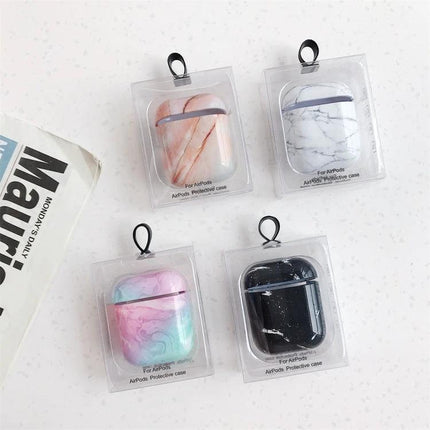 Marble Design Protective Case for Daily AirPods Carry showing four marble-patterned AirPods cases in clear packaging