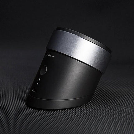 QCY Mini Bluetooth Speaker For Portable Home And Travel shown angled on dark background, compact cylindrical black and silver design