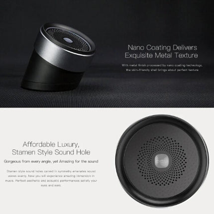 QCY Mini Bluetooth Speaker For Portable Home And Travel compact cylindrical speaker with metal finish for travel and home use