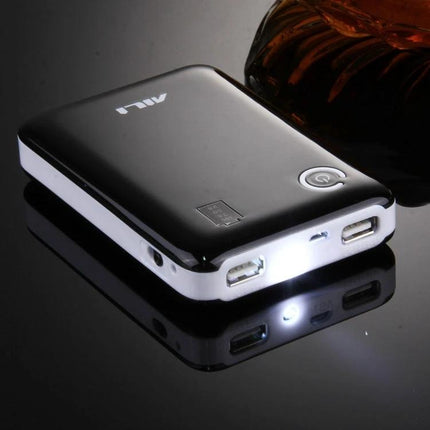 Compact Battery Case for Home and On-the-Go Needs showing a sleek black portable battery case with USB ports and LED light for organized AA/AAA storage